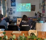 Group of friends at Stillwaters watching the Government apology to survivors of abuse in care, on the television